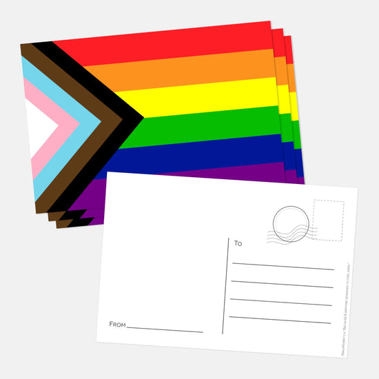 A small stack of postcards with the rainbow progress flag. The top one is flipped over, to show a vintage postcard back.