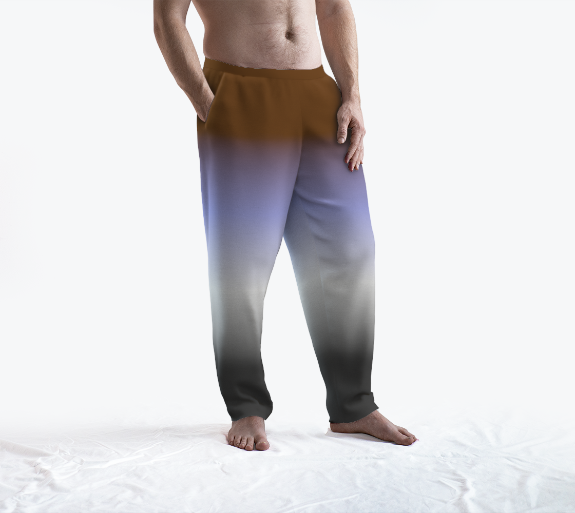 Image of a masculine-presenting model wearing lounge pants. The pants have a gradient colour which changes from top to bottom: brown, lavender, white, and dark grey - the gender apathetic pride flag colours.