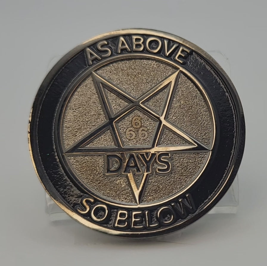  Brief video showing the light shimmering on the back face of a 666 day sobriety coin